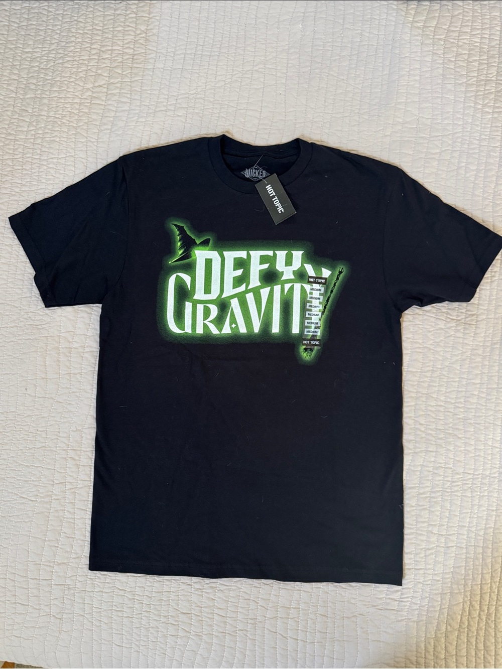Defy Gravity Graphic Tee — Black with Green Logo